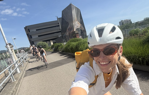 Selfie while riding, with the other cyclists in the background.