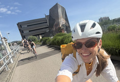 Selfie while riding, with the other cyclists in the background.
