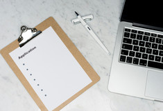 laptop on the right side, application checklist on the left side