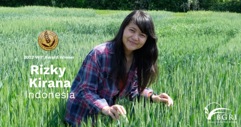 Rizky Kirana standing in a wheat field and smiling into the camera