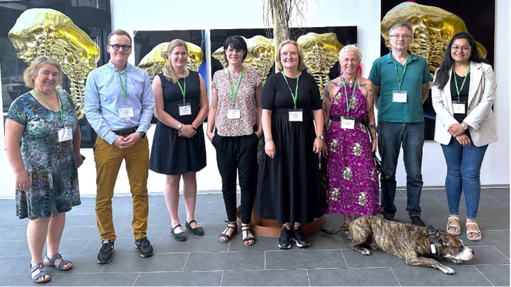 Organizing Team and key note speaker (from left to right): Dr.in Heidrun Holland, Prof. Dominik Egger, Ass.Prof.in Jule Michler, Prof.in Janina Burk, Prof.in Cornelia Kasper, Prof.in Doris Wilfingseder, Prof. Michael Außerlechner, Dr.in Isita Sagar, “Ciroc” (liegend)